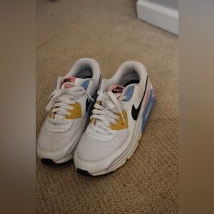 Nike White Sneakers with Yellow, Blue & Black Accents